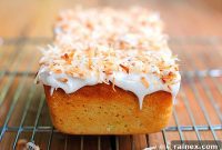 Zesty Lime Delight Cake with Creamy Vanilla Frosting and Golden Coconut Flakes