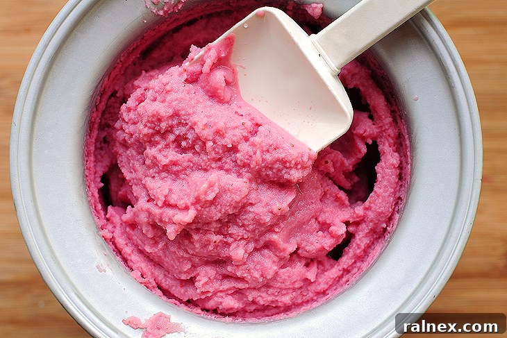 Strawberry Sherbet Recipe Scoops of homemade strawberry sherbet in a bowl.