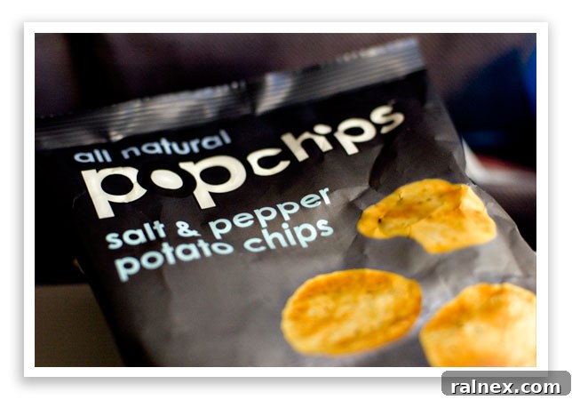 fly10 - A bag of 'popchips' snack on an airplane tray