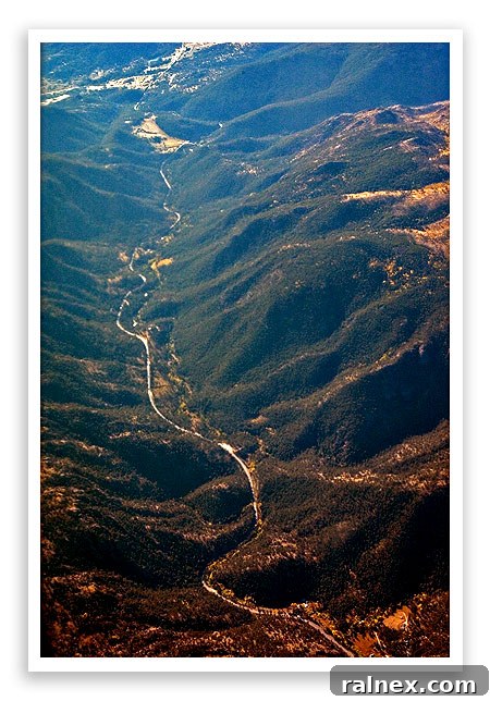 fly24 fly24 - A river winding through a mountainous landscape