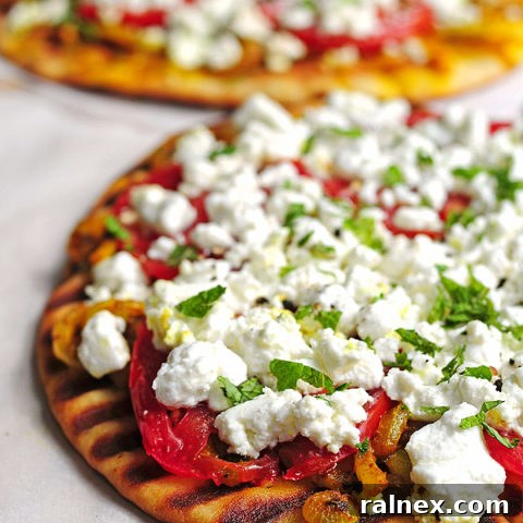 Spiced Naan with Melted Chèvre 2 A vibrant platter of Grilled Spicy Naan with Goat Cheese, ready to serve