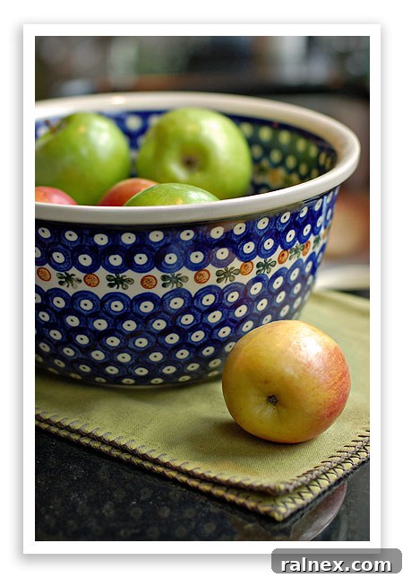 A beautifully hand-painted Polish Pottery tea pot, sugar bowl, and creamer set, showcasing traditional blue patterns.