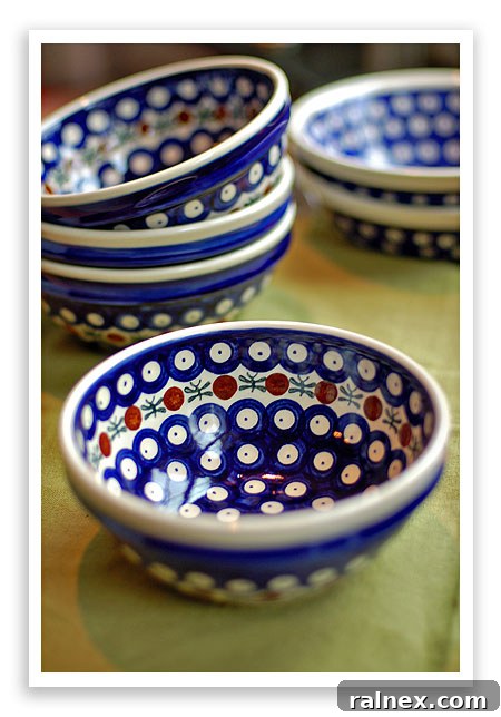 A collection of decorative Polish Pottery bowls in various sizes and patterns, emphasizing their versatility and charm.
