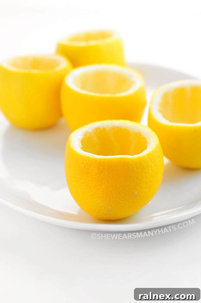 Crafting Irresistible Lemon Cups 15 A beautifully composed Pinterest image featuring a stack of freshly prepared lemon cups, ready for filling with delicious treats.