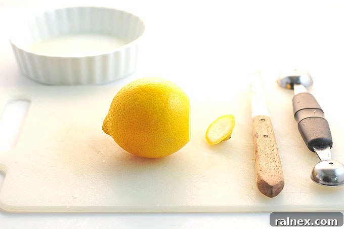 Crafting Irresistible Lemon Cups 4 Step 3: Using a small serrated knife to carefully cut around the inside pith of the lemon, separating pulp from rind.