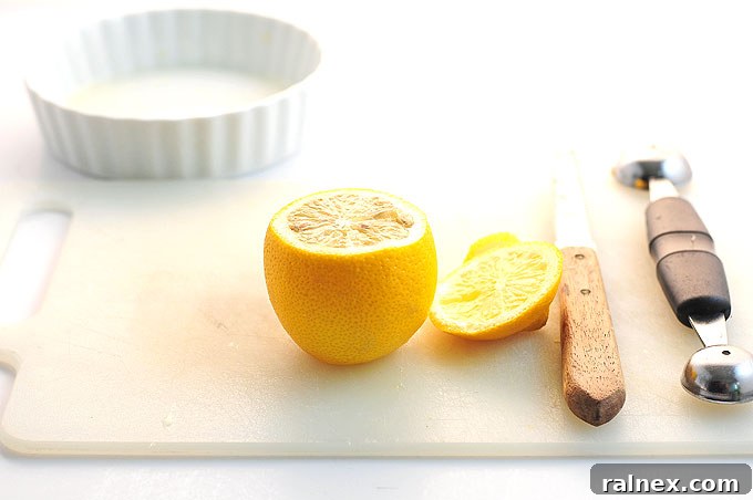 Crafting Irresistible Lemon Cups 7 Step 6: Showing the lemon with its pulp thoroughly loosened, ready for the scooping stage.