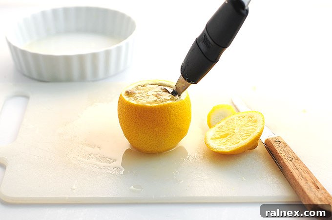 Crafting Irresistible Lemon Cups 9 Step 8: The lemon rind is nearly hollowed out, revealing a clean and intact interior.