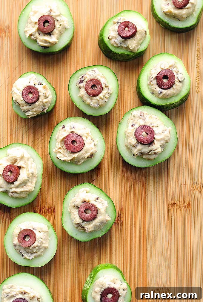 A large image of the finished Olive Cucumber Hummus Cups, ready to be served.