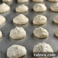 Pecan Meringue Cookies Recipe: Deliciously crispy exterior with a chewy, nutty inside.
