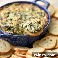 Make a batch of this Spinach Artichoke Dip for your next get together and watch the smiling faces crowd around with a chip in hand.