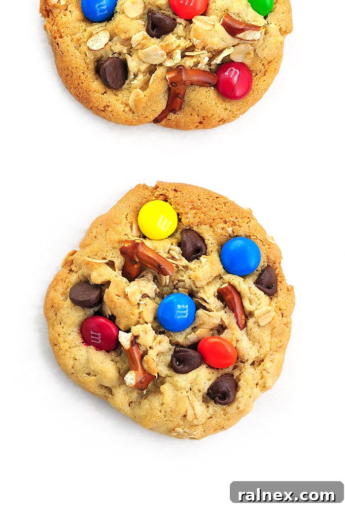 A close-up of delicious Monster Cookies featuring chocolate chips, M&Ms, and pretzel pieces