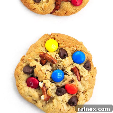 A delicious plate of Monster Cookies featuring colorful M&Ms, chocolate chips, and pretzels