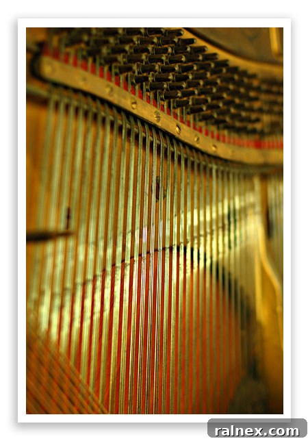 Close-up of old piano interior, showcasing intricate mechanisms