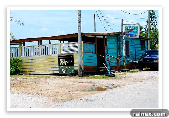 The Hangar Cafe Belize Exterior view of The Hangar Cafe at Belize Municipal Airport, a cozy spot overlooking the water