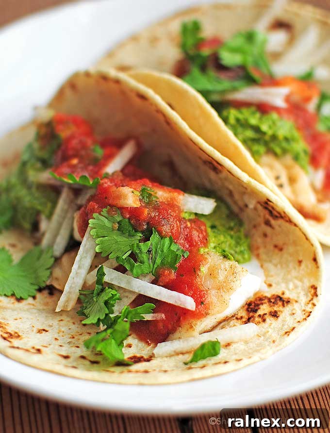 Zesty Fish Taco Perfection 2 Fish Tacos Recipe | shewearsmanyhats.com